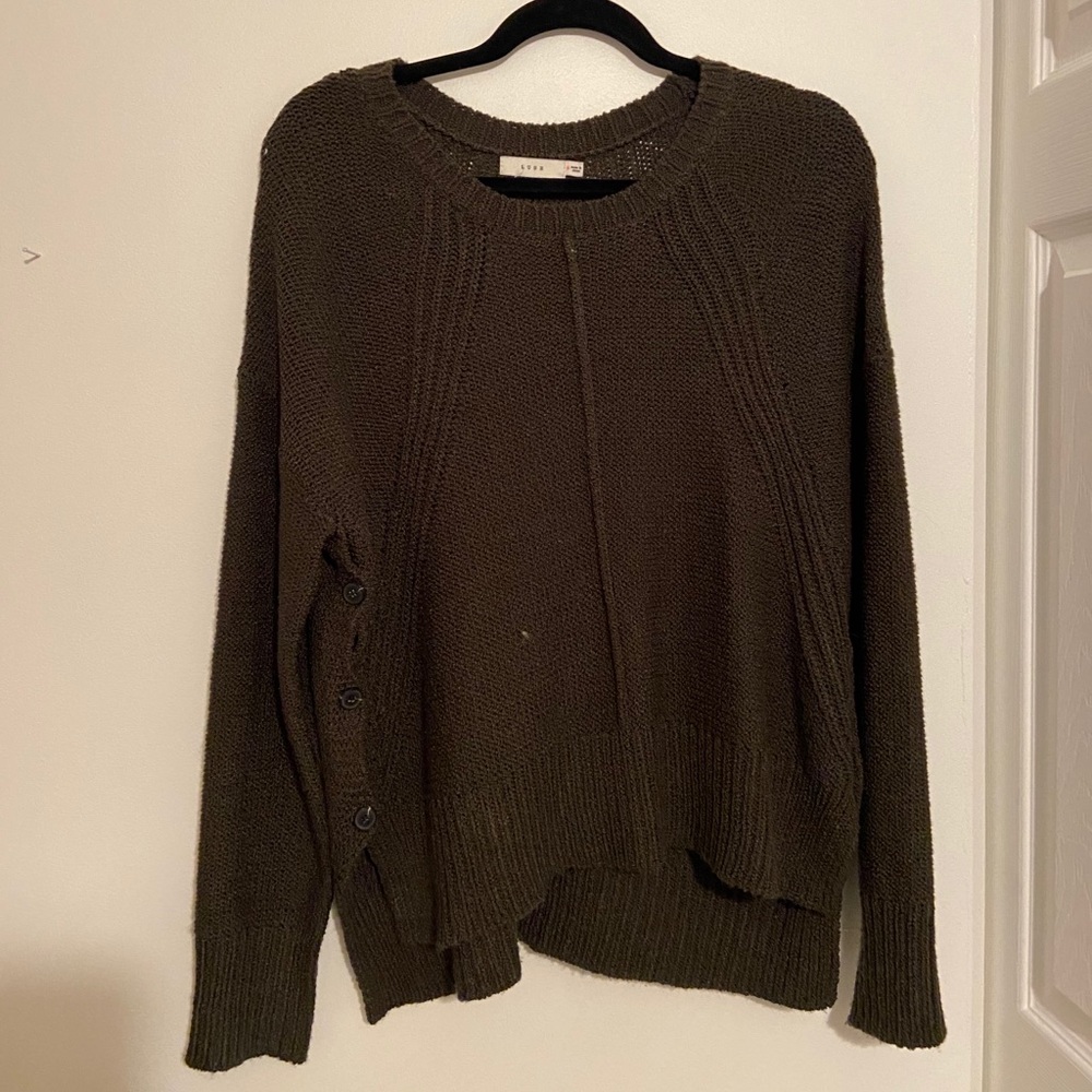 Sweater with button detail on side.